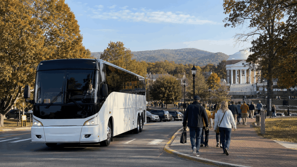 charter bus arriving at the university of virginia campus in charlottesville on a football game day