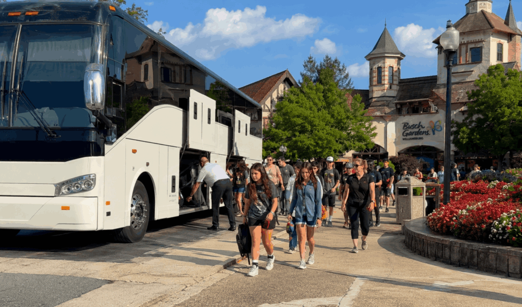group arriving by charter bus at colonial williamsburg visitor center in virginia