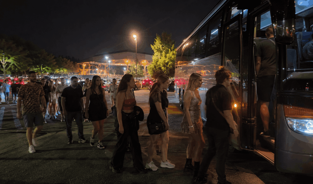 concertgoers boarding a charter bus after a concert at merriweather post pavilion in columbia maryland