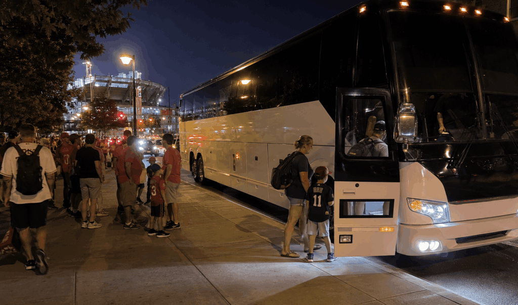 group of baseball fans boarding a charter bus after a washington nationals game near navy yard in washington dc